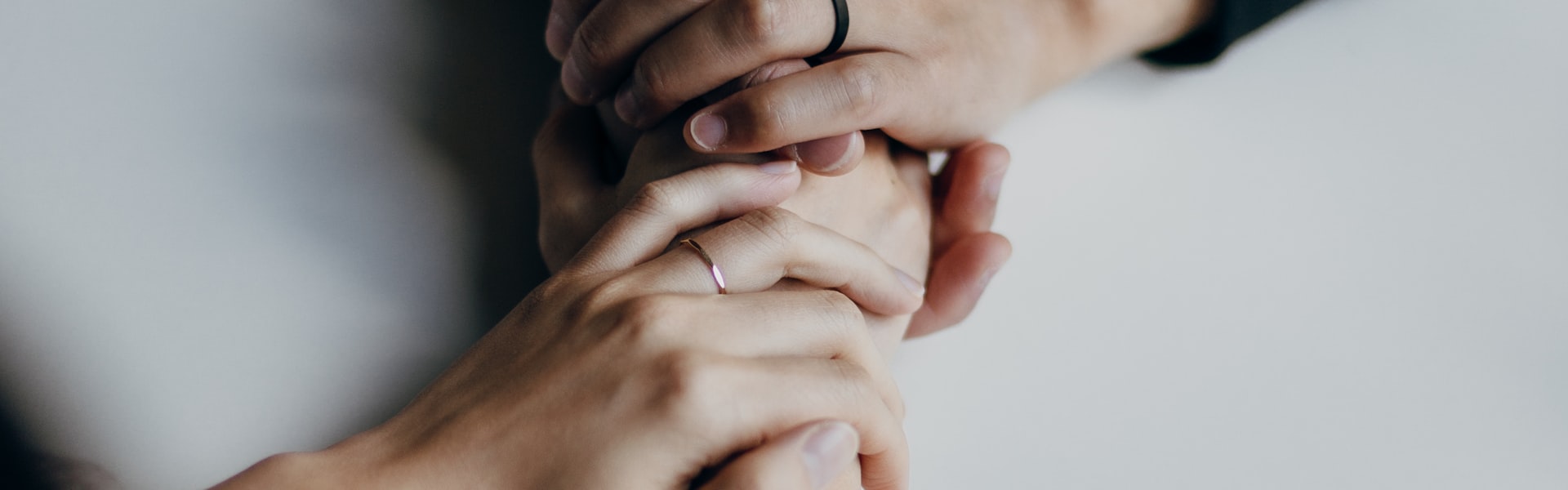 Two people holding hands